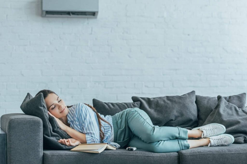 Woman laying on couch